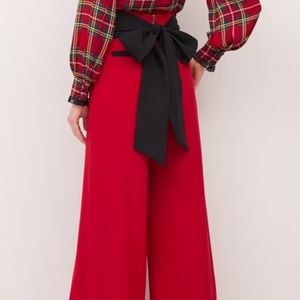 Red pair of New York and Company women’s dress pants with a black tie around